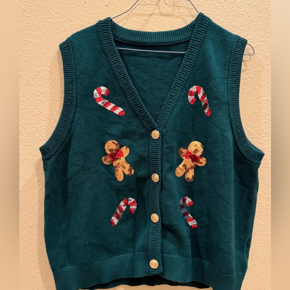 Festive Green Sweater Vest with Candy Cane and Gingerbread Design.